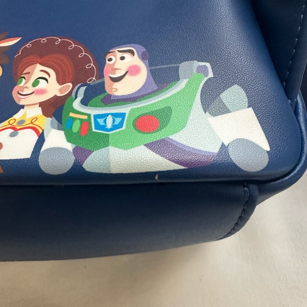 LOUNGEFLY PIXAR MOMEMT TOY STORY WOODY, BO PEEP, & TOYS BACKPACK - Picture 6 of 9